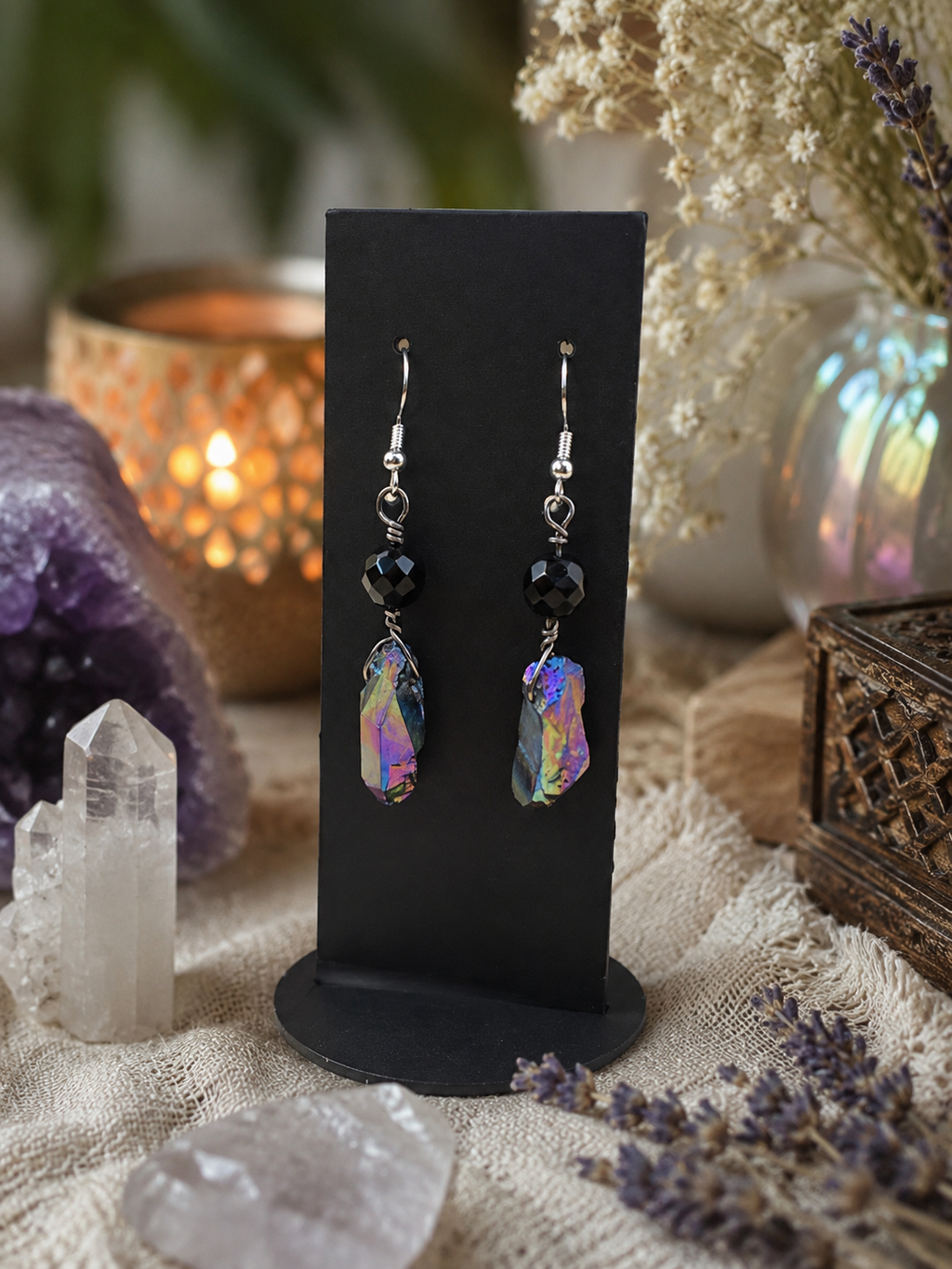 Close-up of Nocturnal Tide aqua aura quartz earrings and sterling silver hooks