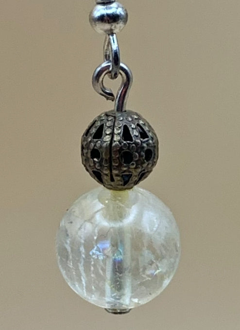 Radiant clear quartz dangle earrings in a styled setting