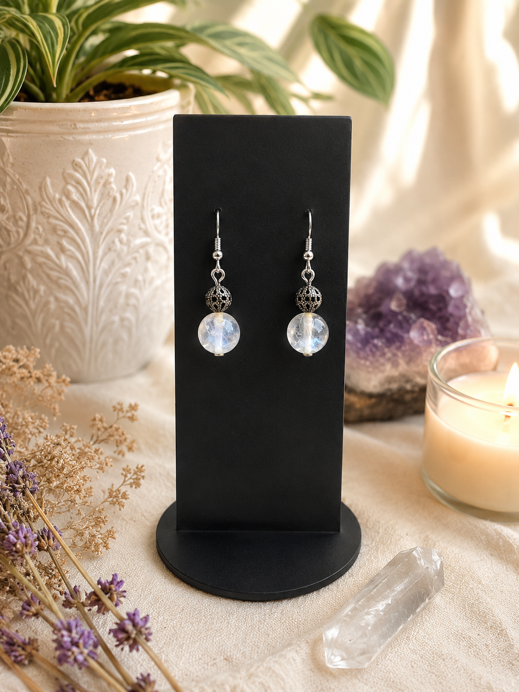 Close-up of Radiant clear quartz earrings and sterling silver hooks